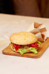 Burger on a wooden board