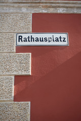 Street sign with the inscription "Rathausplatz" on an old house in Rust / Austria