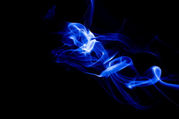 Blue smoke on black background