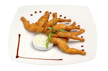 Fried chicken wings with sauce on a plate on a white isolated background. Delicious dishes for restaurants