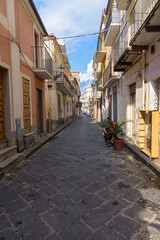 Fototapeta na wymiar Picturesque narrow street in town of Pizzo