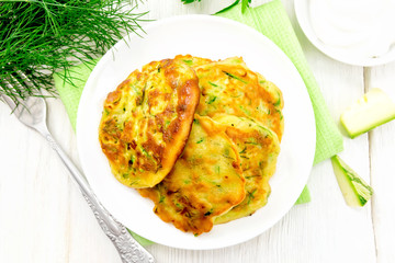 Pancakes of zucchini on board top