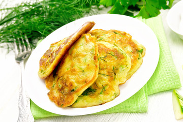 Pancakes of zucchini on board