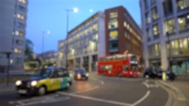Light Traffic in London, UK With Cars, Double Decker Bus and Taxi Cab During Evening