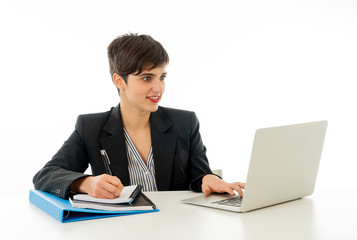 Portrait of happy attractive young businesswoman working on her