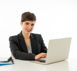 Portrait of happy attractive young businesswoman working on her