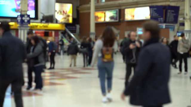Blurry Commuters at Train Station