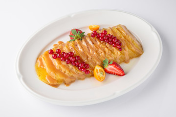 Dessert fried caramelized pineapple in own juice and berries. Banquet festive dishes. Fine dining restaurant menu. White background. 