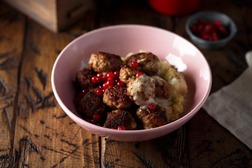 Meatballs with potato and red berries