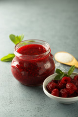 Homemade raspberry jam with fresh mint