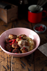 Meatballs with potato and red berries