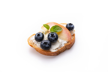 bread toast with peach and blue berry on isolated white background