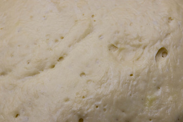 yeast dough as background. texture of fermented dough. ferment for baking.
