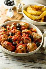 Roasted chicken with tomato and olives