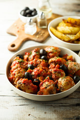 Roasted chicken with tomato and olives