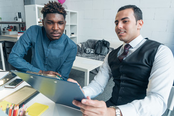 Businessman interns a young African specialist in employment in an international company