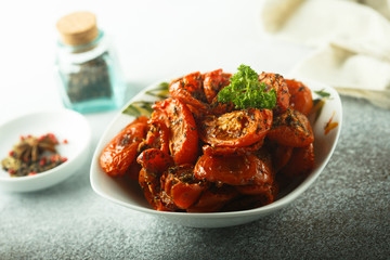 Homemade sun dried tomatoes with herbs