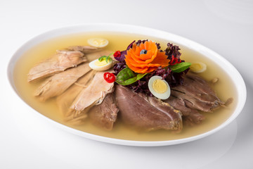 Broth jelly with meat and vegetables. Banquet festive dishes. Gourmet restaurant menu. White background.