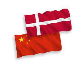 National vector fabric wave flags of Denmark and China isolated on white background 1 to 2 proportion.