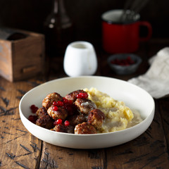 Meatballs with potato and red berries