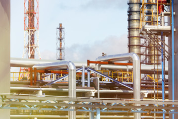 Industrial area of the refinery. Oil refining equipment and pipelines of the refinery. Toned