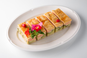 Quiche, casserole, delicious omelet from eggs, cheese, salmon, broccoli, spinach, pate. Banquet festive dishes. Gourmet restaurant menu. White background.