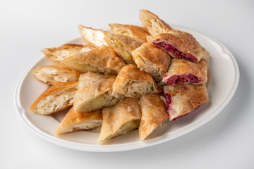 Platter with Platsynda pies with cabbage, potatoes and homemade cheese.