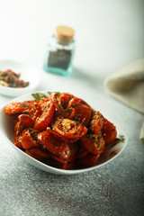 Homemade sun dried tomatoes with herbs