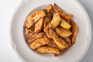 Home-made fried potato garnish.  Banquet festive dishes. Gourmet restaurant menu. White background.