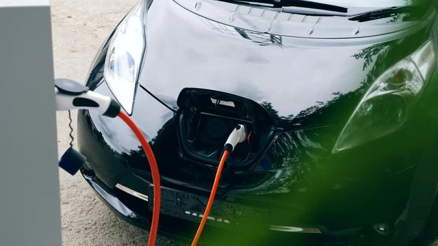 Electrical nozzle is inserted into an electrocar