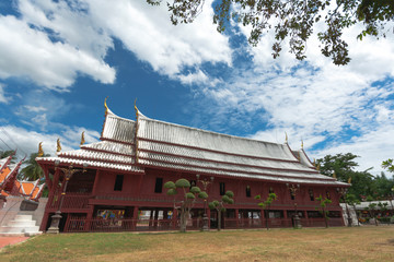 Fototapeta na wymiar Beautiful Sermon hall in a monastery At Wat Yai-Suwannaram. This temple is the royal temple of the Chakri dynasty of Thailand.