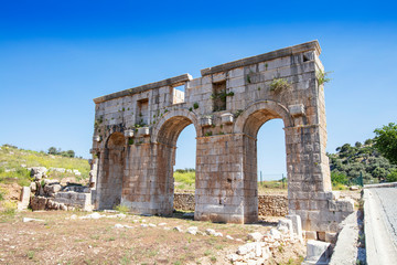 Fototapeta na wymiar Patara (Pttra). Ruins of the ancient Lycian city Patara. Amphi-theatre and the assembly hall of Lycia public. Patara was at the Lycia (Lycian) League's capital. Aerial view shooting. Antalya, TURKEY
