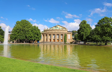 Stuttgart theatre building and fountain in Eckensee lake, Germany