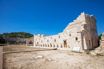 Obraz premium Patara (Pttra). Ruins of the ancient Lycian city Patara. Amphi-theatre and the assembly hall of Lycia public. Patara was at the Lycia (Lycian) League's capital. Aerial view shooting. Antalya, TURKEY