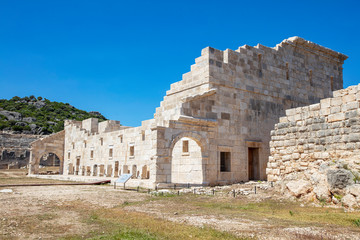 Fototapeta premium Patara (Pttra). Ruins of the ancient Lycian city Patara. Amphi-theatre and the assembly hall of Lycia public. Patara was at the Lycia (Lycian) League's capital. Aerial view shooting. Antalya, TURKEY