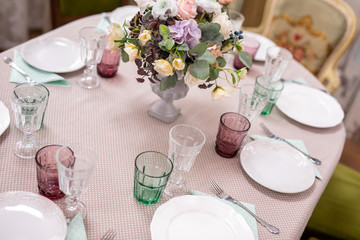 bouquet of flowers in a vase at the wedding table