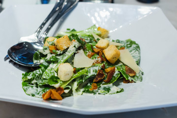 caesar salad on table