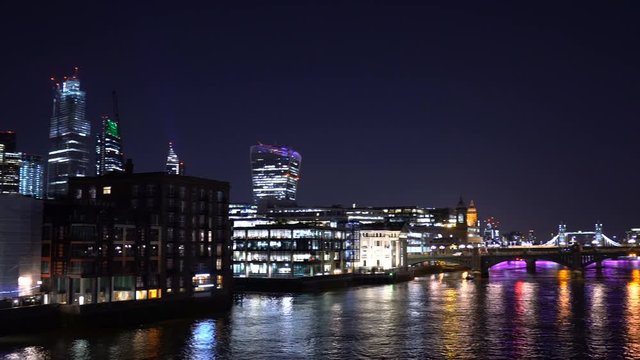 Modern Office Buildings at Thames River in London Panning To City Skyline With The Shard and Tower Bridge in Distance