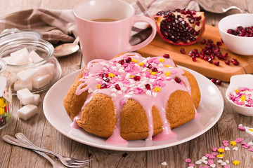 Cake with pink frosting.