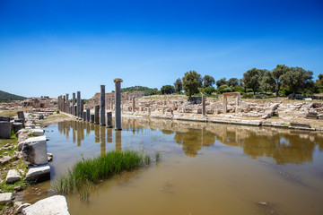 Obraz premium Patara (Pttra). Ruins of the ancient Lycian city Patara. Amphi-theatre and the assembly hall of Lycia public. Patara was at the Lycia (Lycian) League's capital. Aerial view shooting. Antalya, TURKEY