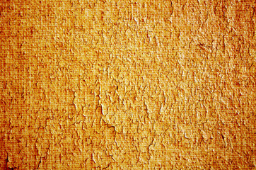Surface of old parchment of brown color. Cracks all over the surface