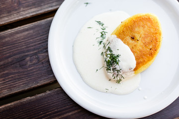 Meat-filled potato pancakes, traditional Lithuanian food on metal pann