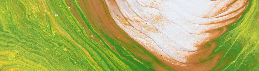 photography of abstract marbleized effect background. brown, orange, green and white creative colors. Beautiful paint