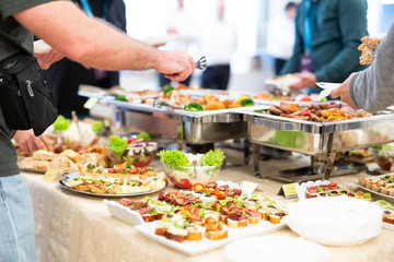 People enjoying party buffet meal