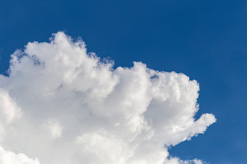 the blue sky background with tiny clouds