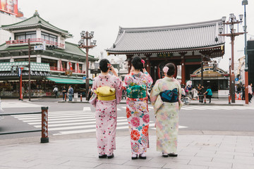 Three women geishas wearing traditional