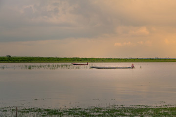 a small fishing boat on the dam