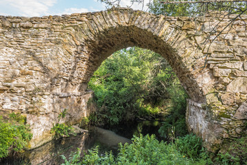 Roman bridge of Catribana, ancient bridge in limestone under a river - Saint John of Lampas, Sintra PORTUGAL