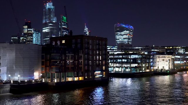 Modern Office Buildings With Large Window Fronts Illumiated at Night in London, UK