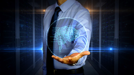 Businessman with cybernetic brain symbol hologram